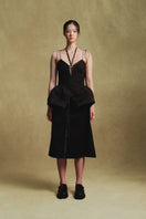Black balloon hem top by Sean Sheila, featuring a stylish, flowy silhouette and unique balloon sleeves.