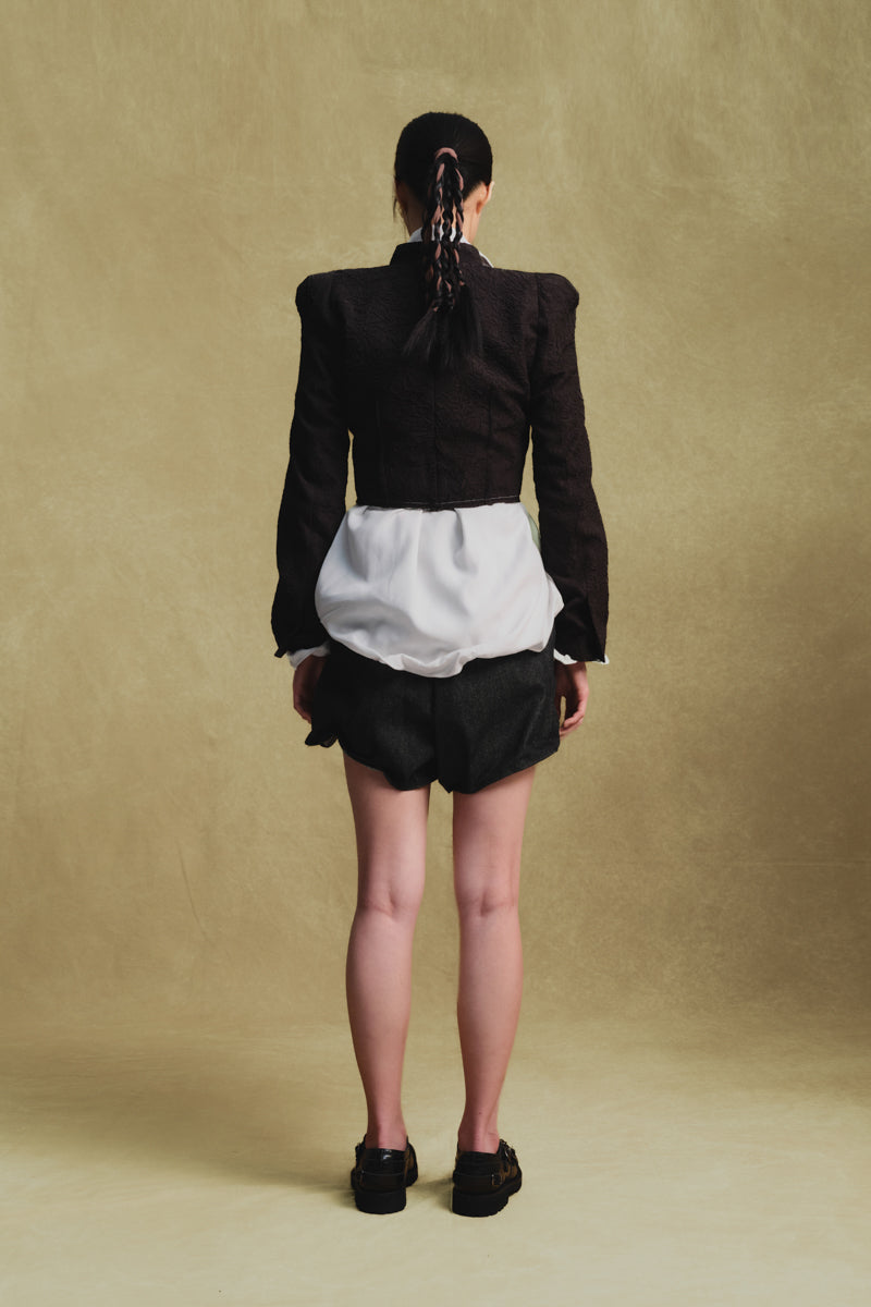 Black crinkled cropped jacket by Sean Sheila, showing the back view with textured fabric and stylish fit.