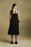 Black jacquard camisole top by Sean Sheila, shown from the back with intricate woven pattern and adjustable straps.