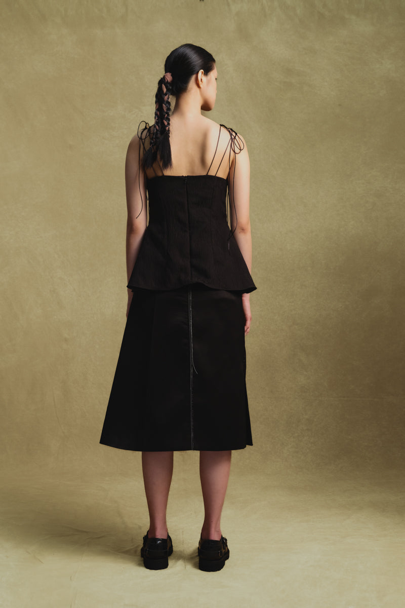 Black jacquard camisole top by Sean Sheila, shown from the back with intricate woven pattern and adjustable straps.