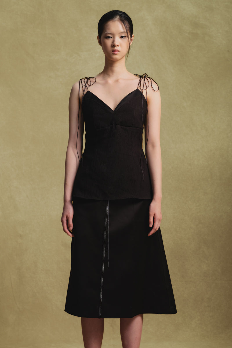 Black jacquard camisole top by Sean Sheila, detailed close-up showing intricate fabric pattern and stylish neckline.