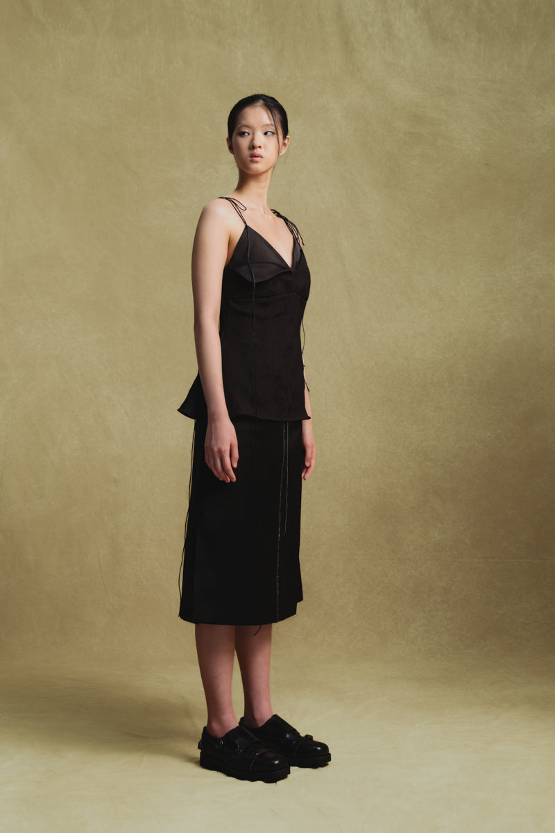 Black Jacquard camisole top by Sean Sheila, shown from the side with intricate fabric pattern and stylish fit.