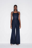 Blue denim jumpsuit by Lili Blanc with crystal embellishments and a fitted silhouette, ideal for stylish casual or evening wear.