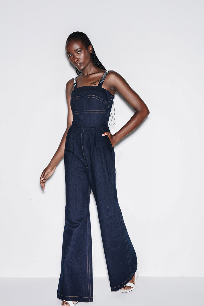 Blue denim crystal-embellished jumpsuit by Lili Blanc, featuring a stylish design and detailed crystal accents.