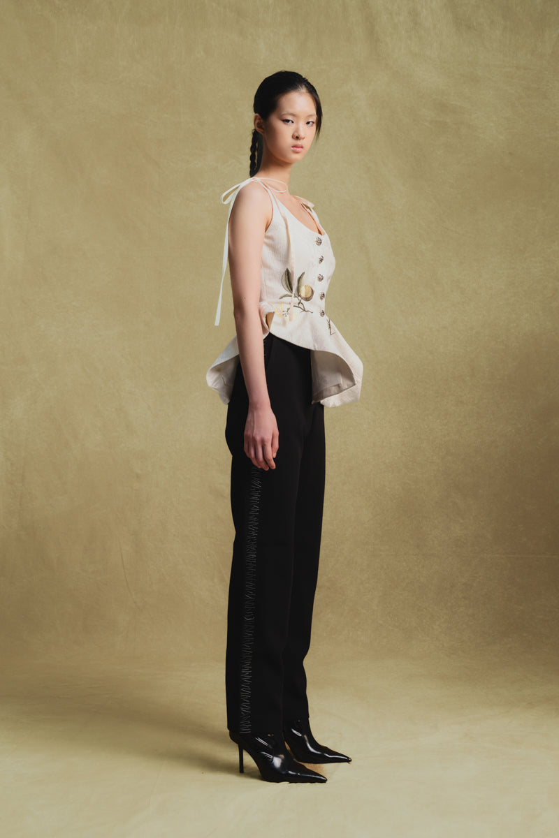 White Jacquard tank top by Sean Sheila, shown from a side view, featuring intricate woven patterns and a sleeveless design.