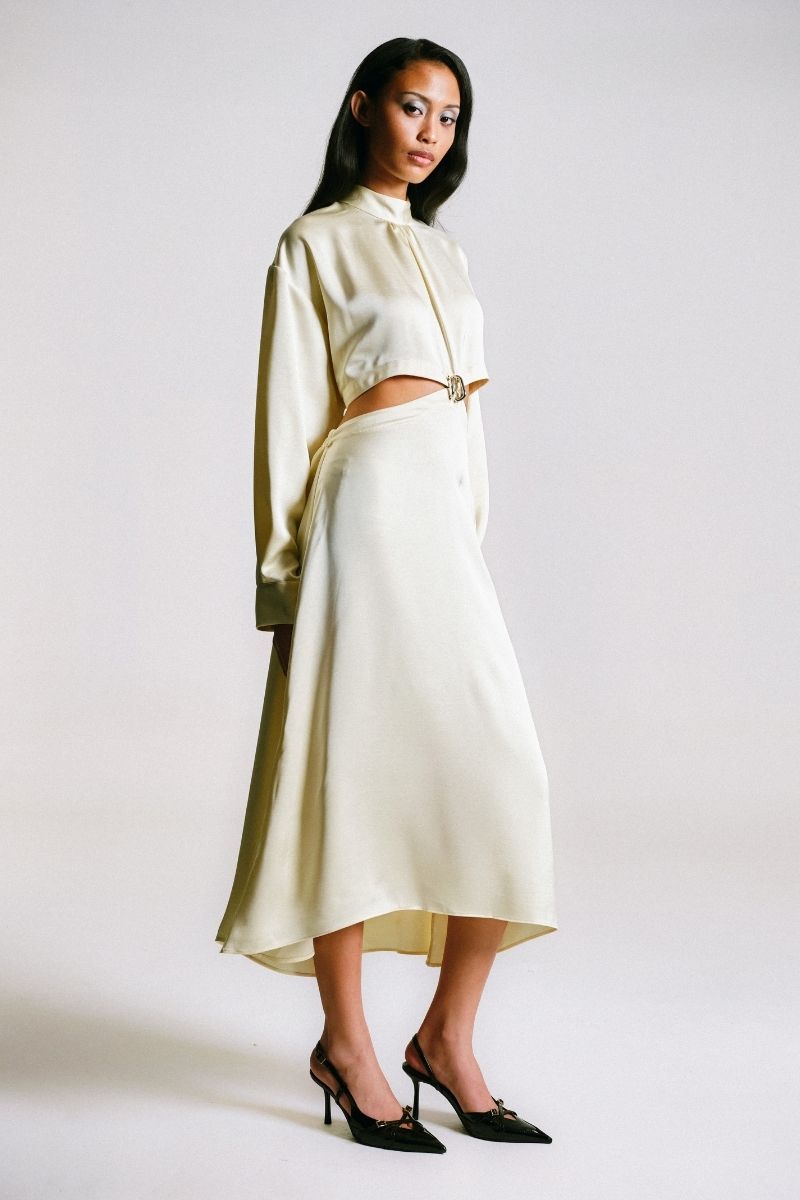 Side view of a Sean Sheila cut-out maxi dress with piercing details, showcasing its stylish design and sleek silhouette.