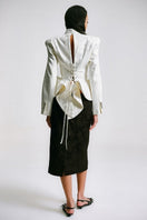 Back view of Sean Sheila BESKAP jacket with flared hems, stylish outerwear in a modern design with a tailored fit.