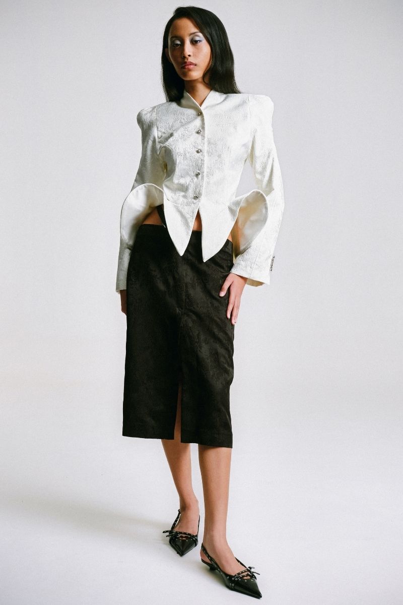 Sean Sheila BESKAP jacket with flared hems, stylish outerwear featuring a tailored fit and unique flared hem design.