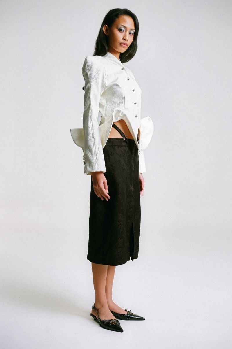 Sean Sheila BESKAP jacket with flared hems, stylish outerwear featuring a tailored fit and dramatic flared sleeve details.