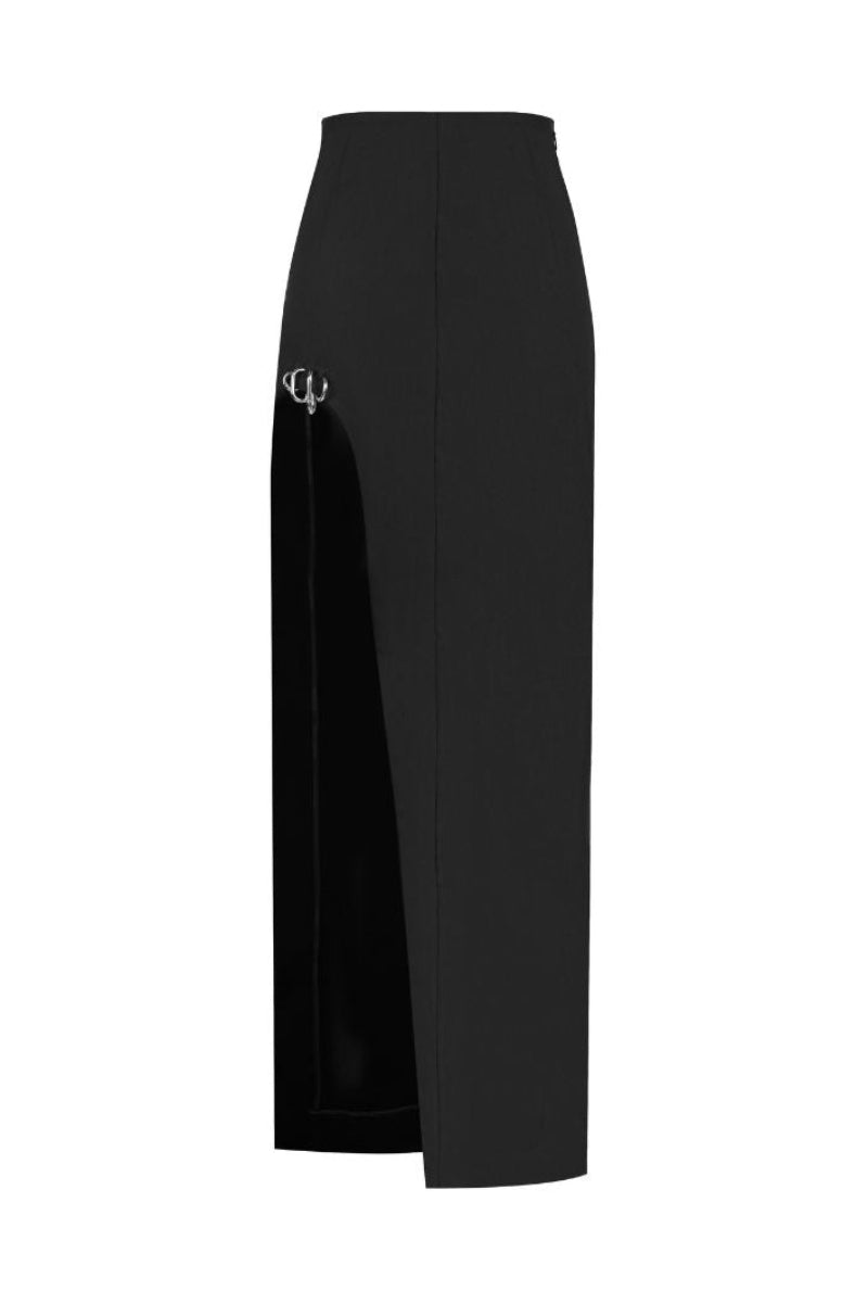 Black Sean Sheila maxi skirt with cut-out slit and piercing detail, shown from the front. Elegant, stylish, and form-fitting design.