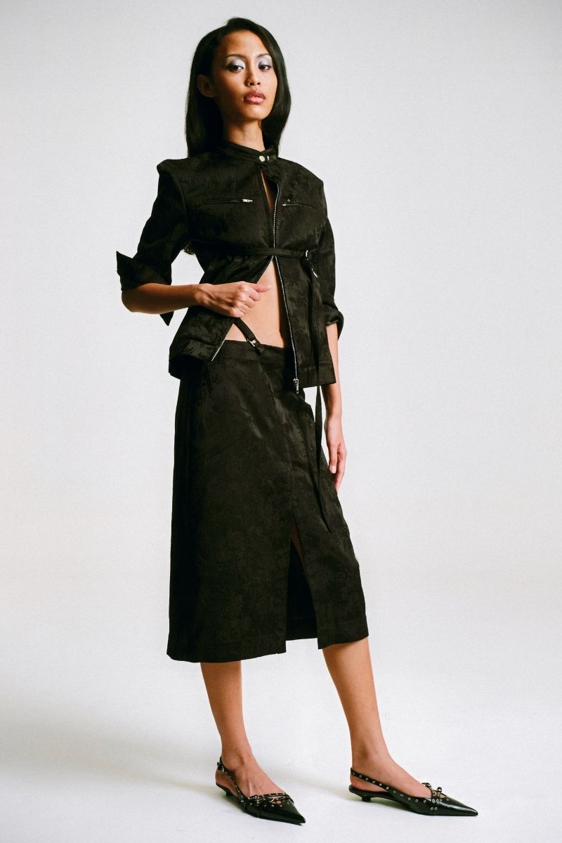 Sean Sheila cropped Mandarin motorcycle jacket shown from the side, featuring a stylish design and tailored fit.