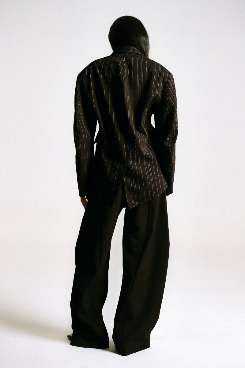 Back view of Sean Sheila cowboy pants with classic stitching and denim fabric, showcasing a relaxed fit and stylish Western design.