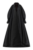 Lili Blanc fluid longline overcoat in a sleek, lightweight fabric, shown from the front with a classic collar and tailored fit.