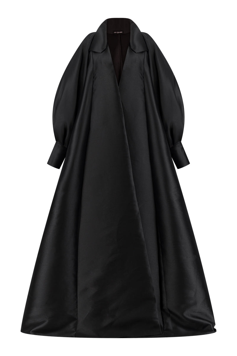 Lili Blanc fluid longline overcoat in a sleek, lightweight fabric, shown from the front with a classic collar and tailored fit.