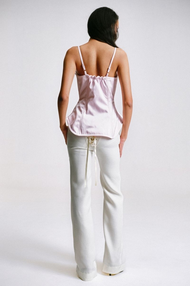 Back view of Sean Sheila deconstructed pink corset top, showcasing structured design and detailed stitching on a stylish women's top.