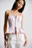Sean Sheila deconstructed pink corset top, detailed view showcasing the unique design and fabric texture of this stylish women's top.