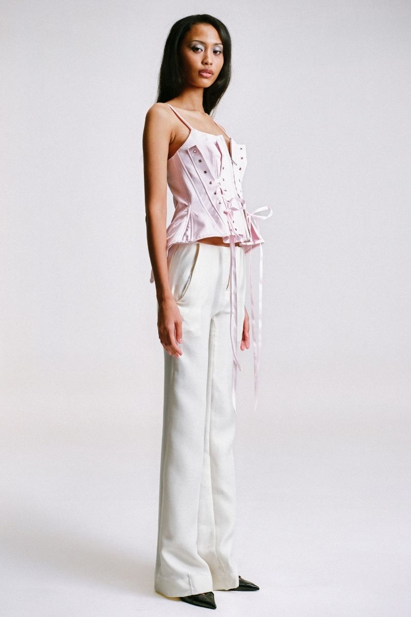 Sean Sheila deconstructed pink corset top with edgy design, shown from side view in this stylish tops image.