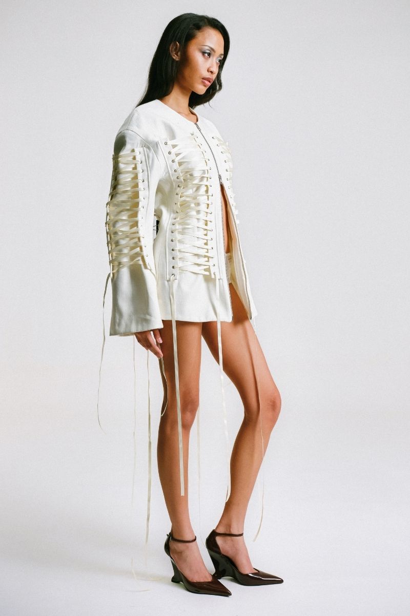 Sean Sheila tailored corset jacket with structured fit and sleek design, shown from the side view in a stylish jacket image.