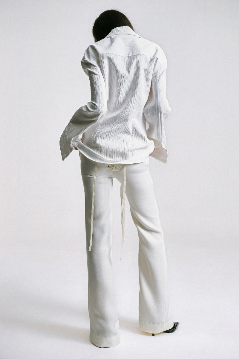 Sean Sheila tailored shirt with belt opening, featuring a sleek design and fitted silhouette, shown from the back.
