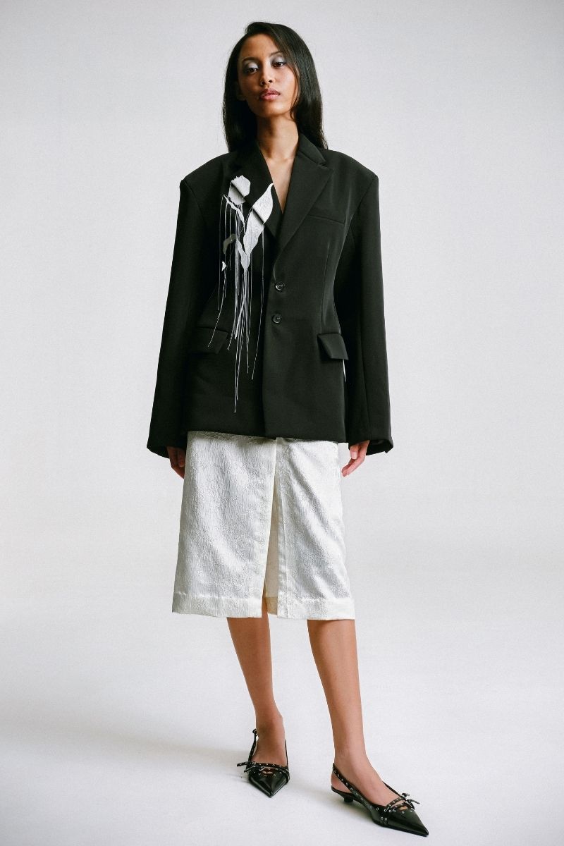 Embossed tailored jacket by Sean Sheila featuring intricate embroidery, front view showcasing detailed design and craftsmanship.