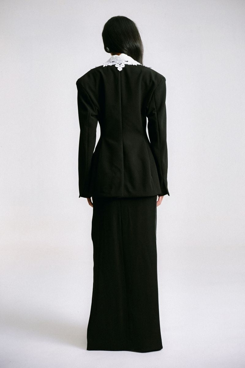 Black tailored suit jacket with embroidered collar by Sean Sheila, featuring a sleek back view with detailed embroidery.