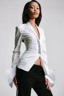 White kebaya shirt with corset detail by Sean Sheila, featuring traditional-inspired design and intricate tailoring.