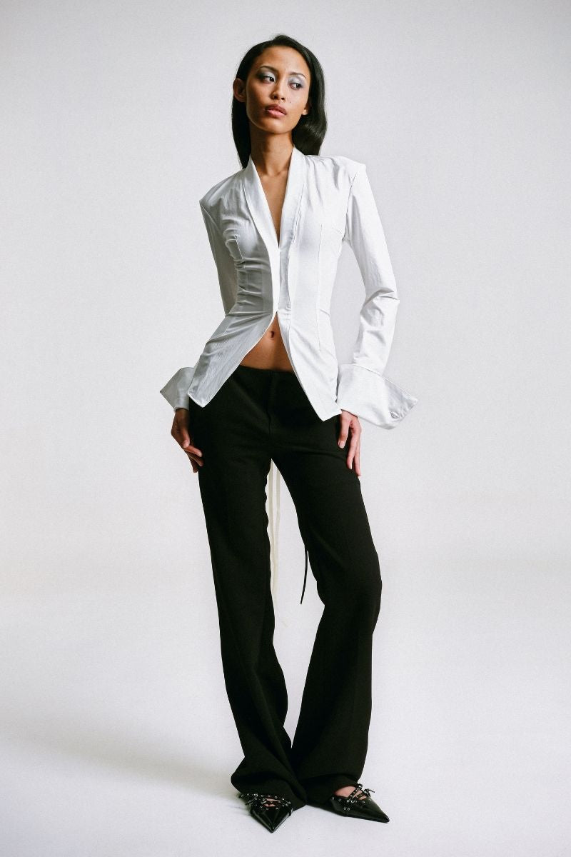 White kebaya shirt with corset detail from Sean Sheila, featuring intricate design and tailored fit.