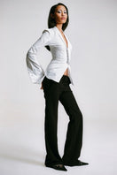 White kebaya shirt with corset detail by Sean Sheila, showcasing intricate design and tailored fit.