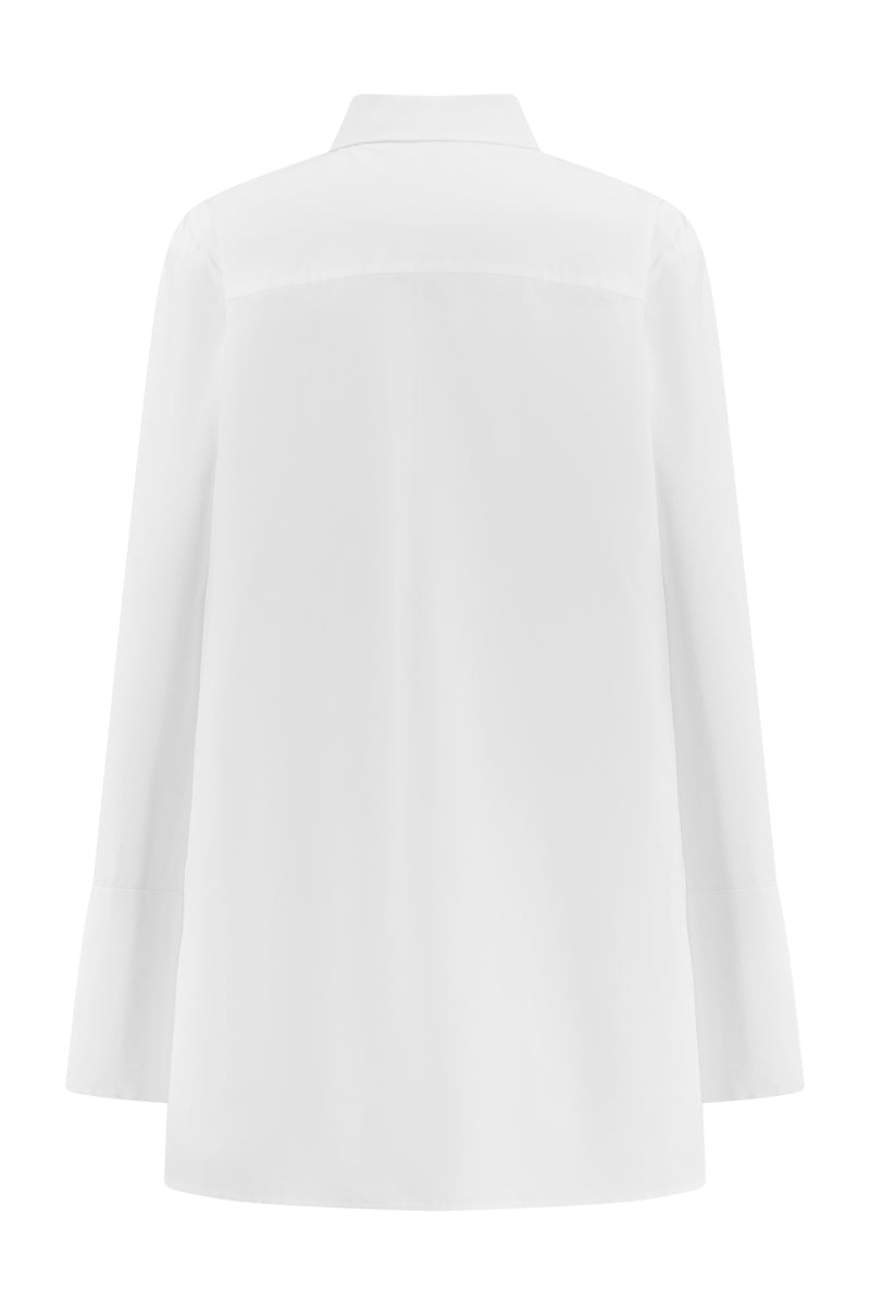 Lili Blanc oversized cotton shirt showing the back view with a relaxed fit and tailored design, in a soft, lightweight fabric.