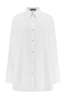 Light beige oversized cotton shirt by Lili Blanc with a relaxed fit, front button closure, and classic collar, shown from the front.