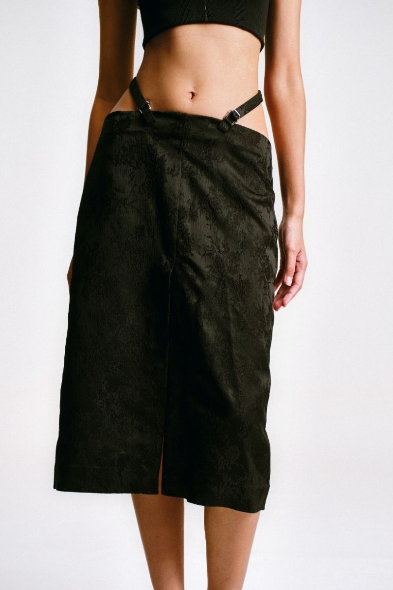 Black midi pencil skirt with stencil detail from Sean Sheila, showcasing a fitted silhouette and stylish design.