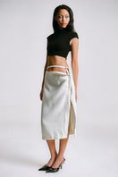 White midi pencil skirt with stencil detail by Sean Sheila, shown from a side angle.