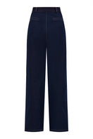 Back view of Lili Blanc tailored straight-leg denim trousers showing classic blue jeans fit and stitching details.