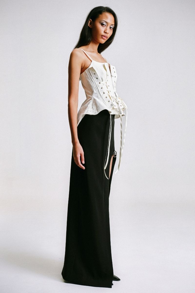 Side view of Sean Sheila deconstructed white corset top, showcasing its structured design and stylish fit.