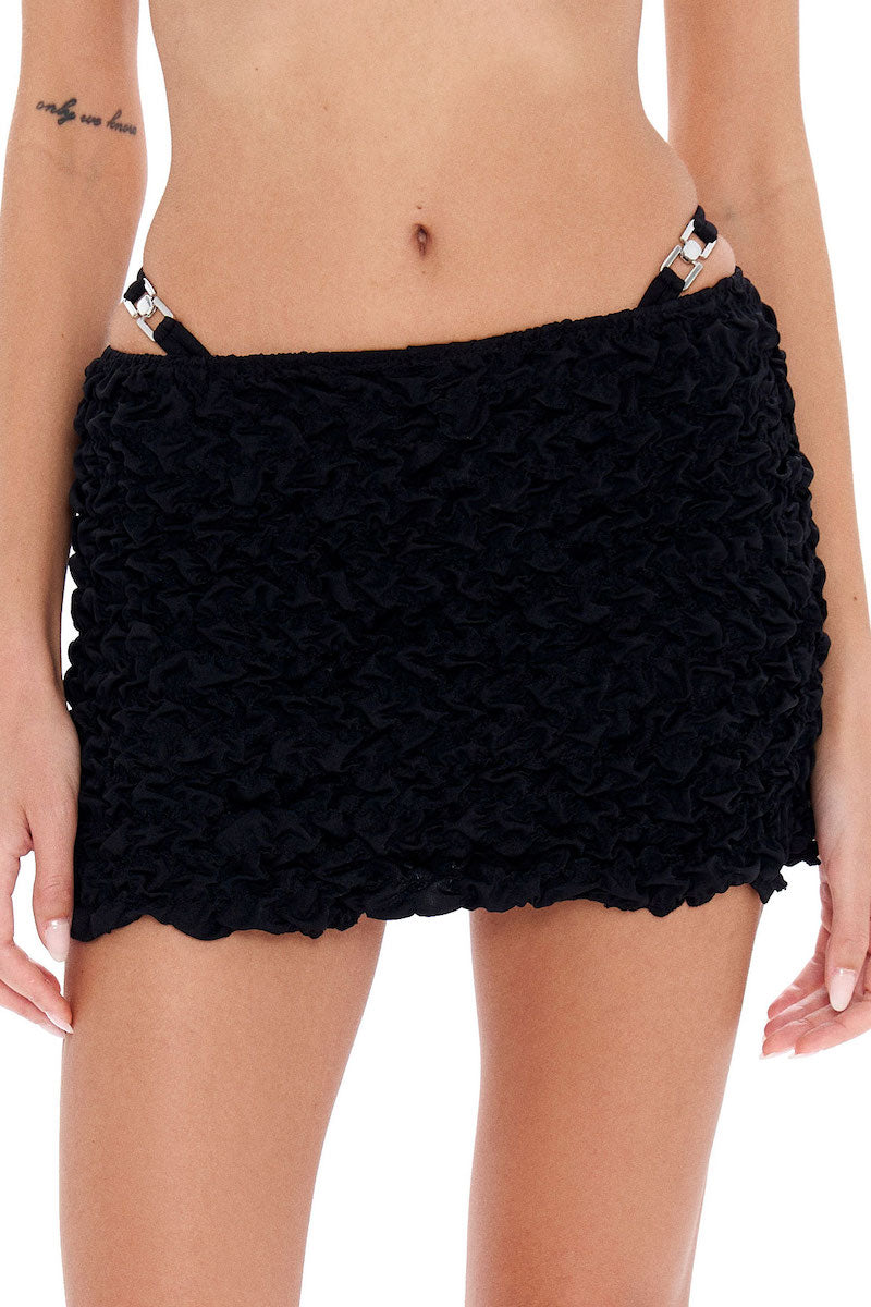 Selia Richwood LIA black mini beach skirt cover-up, lightweight fabric with a stylish mini length, ideal for beachwear.