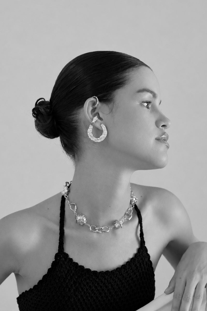 Sara & Flora mountain-inspired hoops earrings in gold-tone with intricate detailing, stylish and lightweight jewelry.