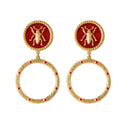 Red bug earrings with hoop design from Natia x Lako, showcasing detailed red bug charms hanging from silver hoops.