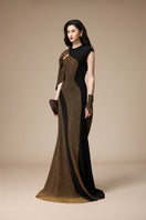 Jenny K Tran Stardust black and gold glitter gown, elegant evening dress with shimmering details and flowing fabric.