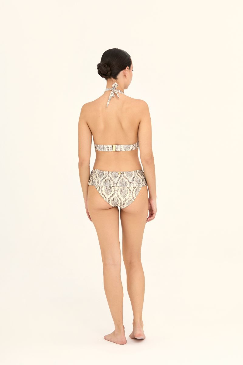 Aguaclara Sultana Missy bikini bottoms in vibrant floral print, shown on a model with a high-cut leg design.