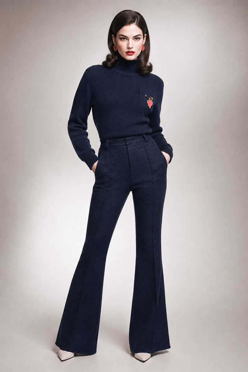 Liya sweater featuring a heart pendant, cozy knit design, and stylish fit, perfect for casual and chic looks.
