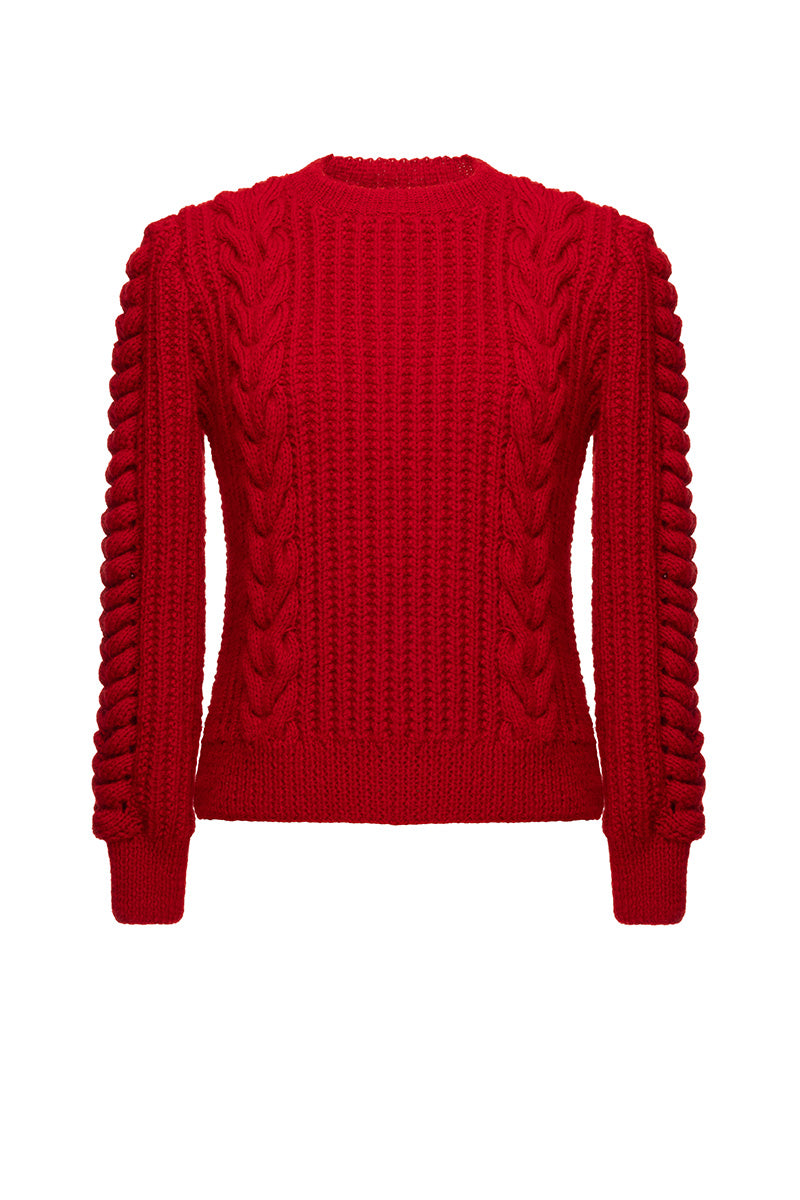Liya red heritage sweater with classic knit design, long sleeves, and ribbed cuffs, displayed on a neutral background.