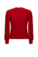 Liya red heritage sweater with classic knit design, long sleeves, and ribbed cuffs, displayed on a neutral background.