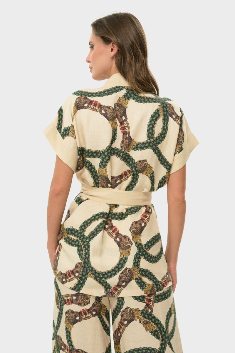 NiLuu short sleeve wrap top in Celine style, featuring a fitted design and elegant fabric, shown in a neutral color.