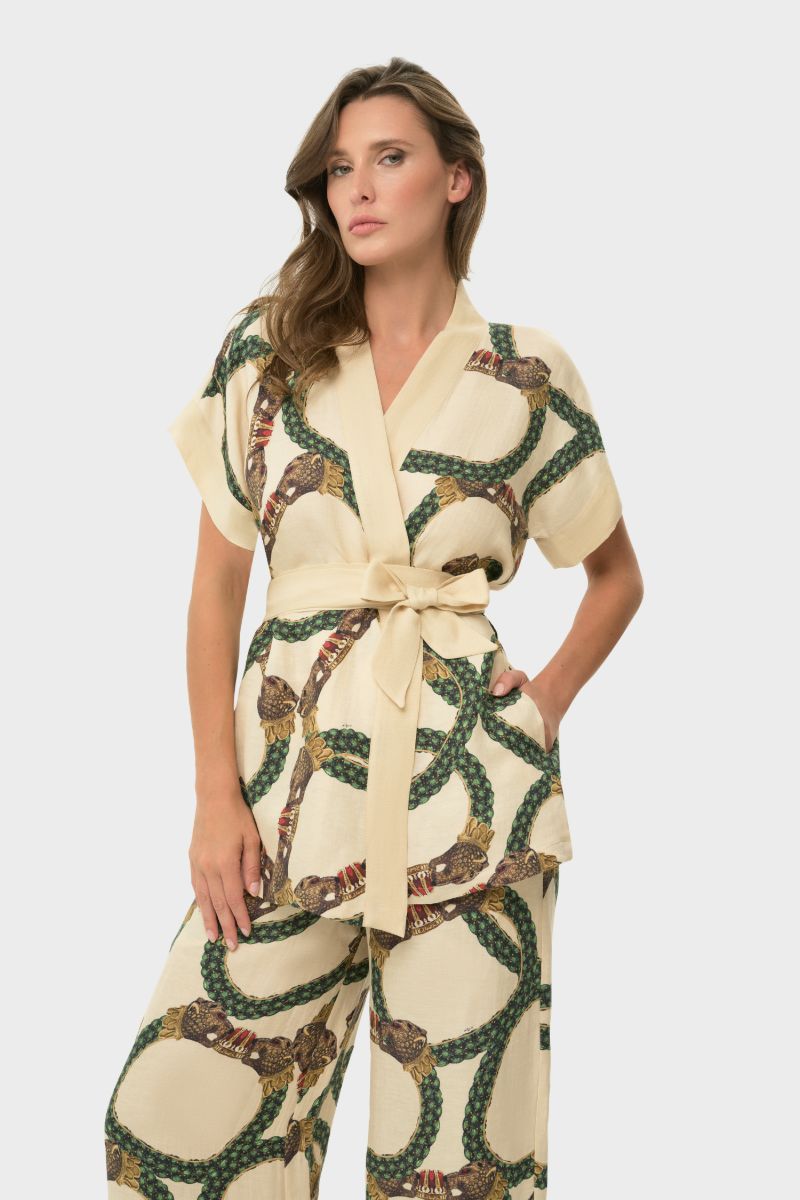 NiLuu short sleeve wrap top in Celine design, featuring a stylish, fitted silhouette and elegant wrap detail.