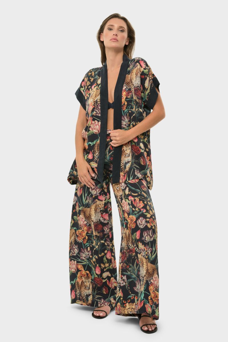 NiLuu short sleeve wrap top in Presley fabric, featuring a stylish design with a flattering fit.