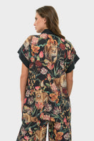 niLuu short sleeve wrap top in Presley fabric, featuring a stylish and fitted design with a V-neck and wrap detailing.