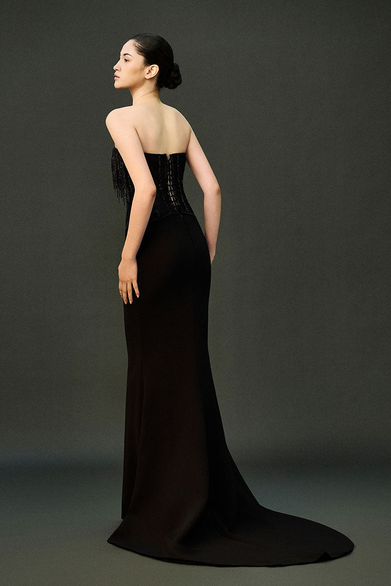Black gown from EEGEN STUDIO's REEMA SET collection, featuring elegant design and flowing fabric.
