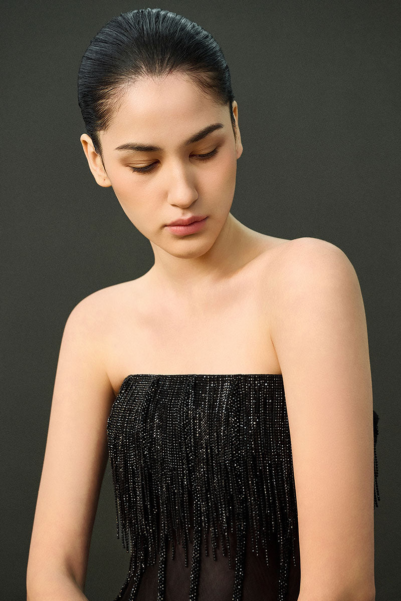 Black Reema gown by EEGEN STUDIO, featuring elegant traditional design with intricate embroidery and flowing fabric.