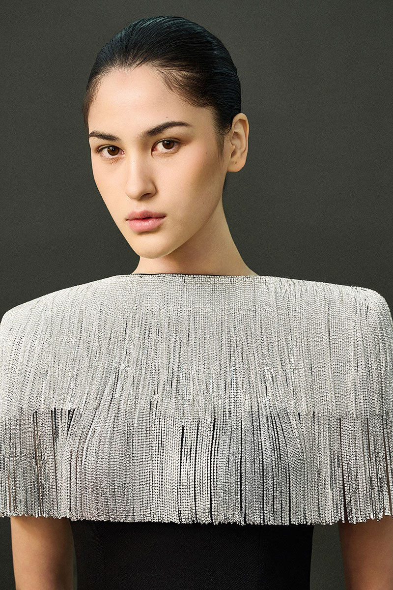 Elegant black sable gown by EEGEN STUDIO, featuring flowing fabric and detailed design, perfect for formal occasions.