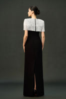 Black Sable gown by EEGEN STUDIO featuring elegant fabric and flowing design, perfect for formal occasions.